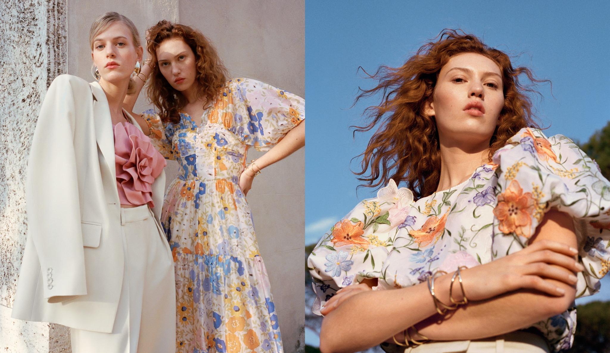 Fashion editorial featuring three women wearing elegant spring outfits. On the left, one woman wears a cream-colored suit over a pink ruffled top, while the other stands beside her in a pastel floral dress with puffed sleeves. On the right, a close-up of a woman in a similar floral blouse poses confidently outdoors under a clear blue sky, with her curly red hair flowing in the breeze