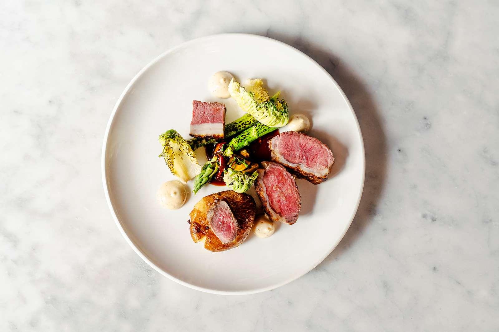 Pichet restaurant beautifully presented meat dish on white plate
